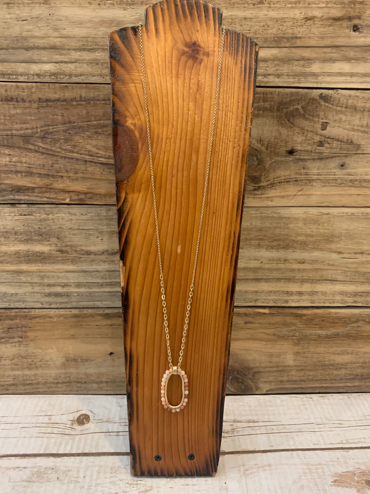Gold peach stone oval necklace